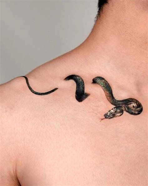 snake tattoo between breast